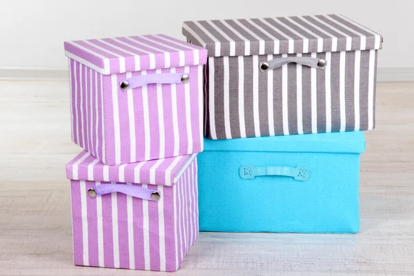 Textile boxes on floor in room — Stock Photo, Image