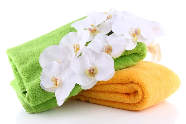 Colorful towels and flowers, isolated on white — Stock Photo, Image