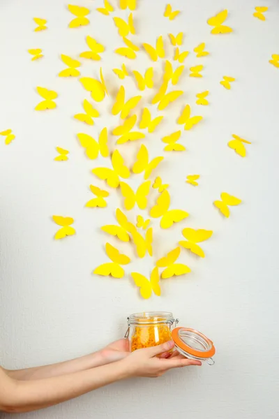 Paper yellow butterflies fly out of bank — Stock Photo, Image