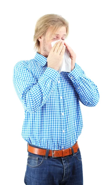 Sneezing young man isolated on white — Stock Photo, Image