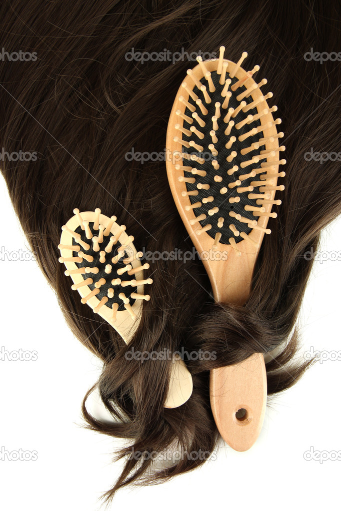 Shiny brown hair with combs isolated on white