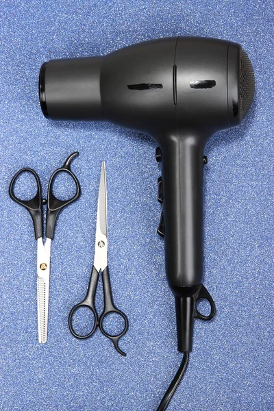 Hairdressing tools on blue background — Stock Photo, Image