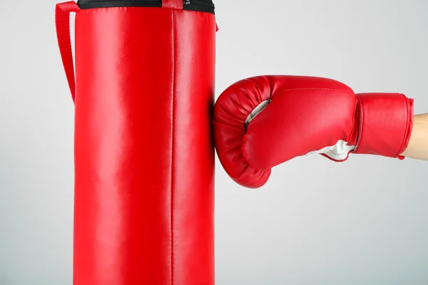 Box training and punching bag, on color background — Stock Photo, Image