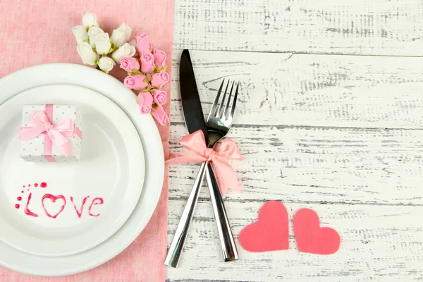 Romantic holiday table setting, on wooden background — Stock Photo, Image