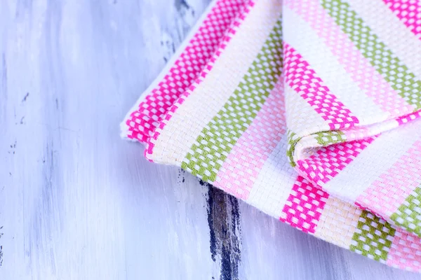 Kitchen towels on wooden background — Stock Photo, Image