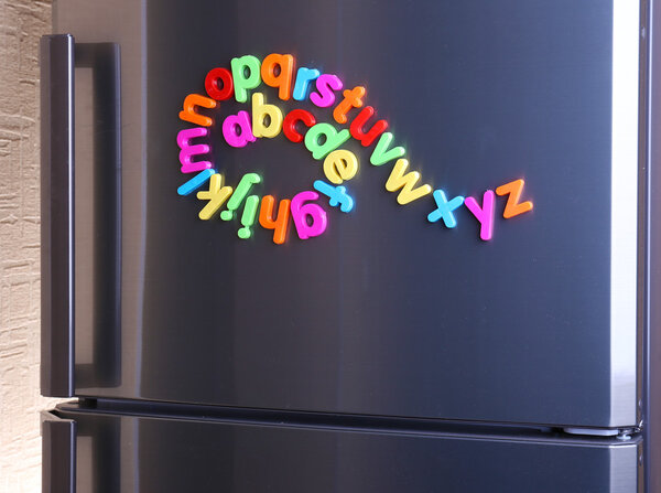 Colorful magnetic letters on refrigerator