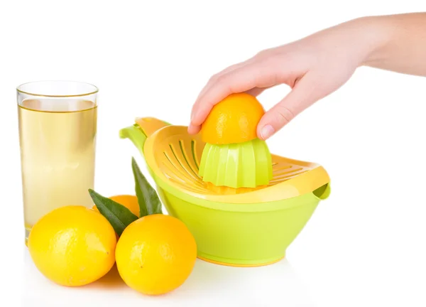 Preparing fresh lemon juice squeezed with hand juicer isolated on white — Stock Photo, Image