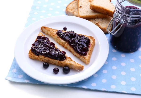 Delicious toast with jam on plate close-up — Stock Photo, Image