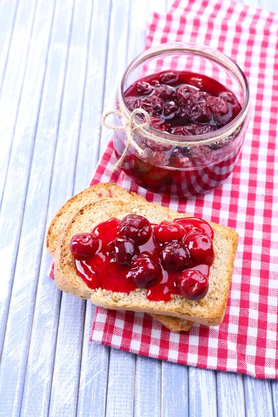 Delicious toast with jam on table close-up — Stock Photo, Image