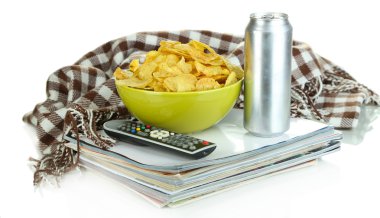 Chips in bowl and TV remote isolated on white clipart