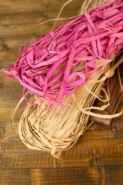 Decorative straw for hand made, on wooden background — Stock Photo, Image