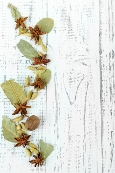 Herbs and spices border, on wooden background — Stock Photo, Image