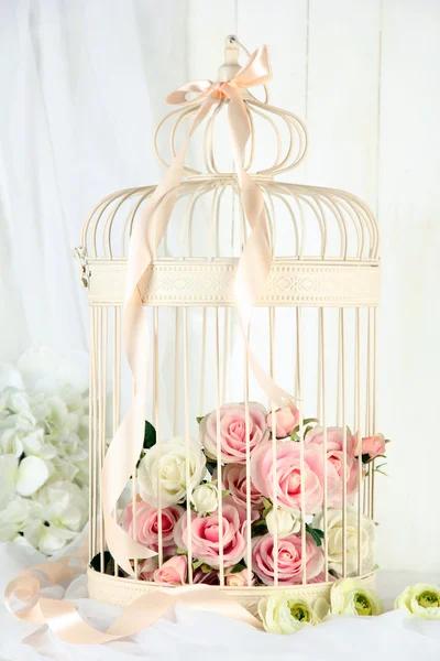 Beautiful decorative cage with beautiful flowers — Stock Photo, Image