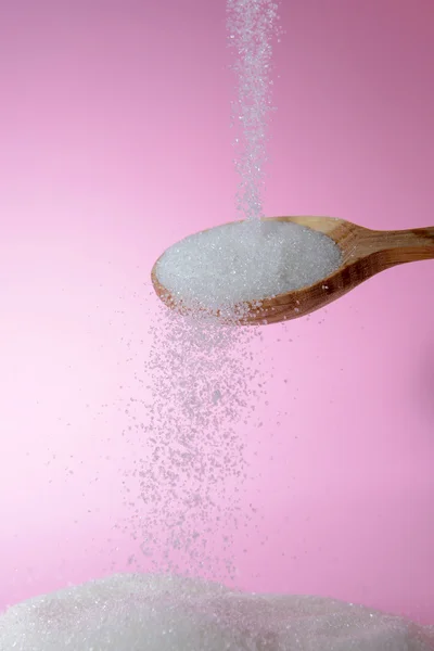 Sugar on pink background — Stock Photo, Image