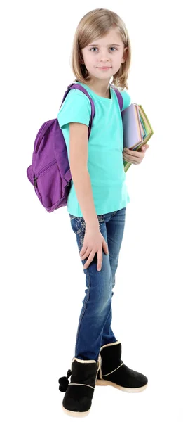 Beautiful little girl with backpack holding books isolated on white — Stock Photo, Image