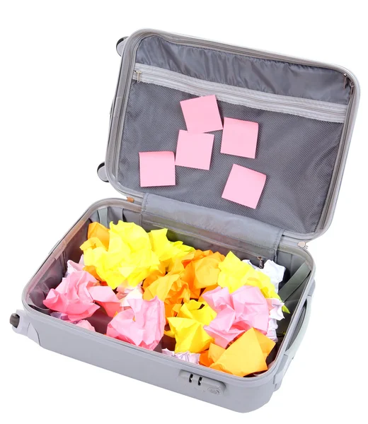 Open suitcase with paper stickers isolated on white — Stock Photo, Image