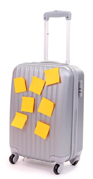 Koffer met papier stickers geïsoleerd op wit — Stockfoto