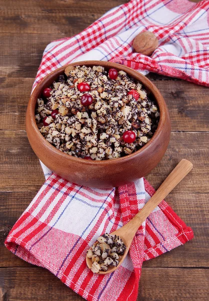 Plate with kutia - traditional Christmas sweet meal in Ukraine, Belarus and Poland, on wooden background — Stock Photo, Image