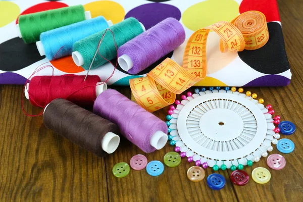 Sewing accessories on wooden table — Stock Photo, Image