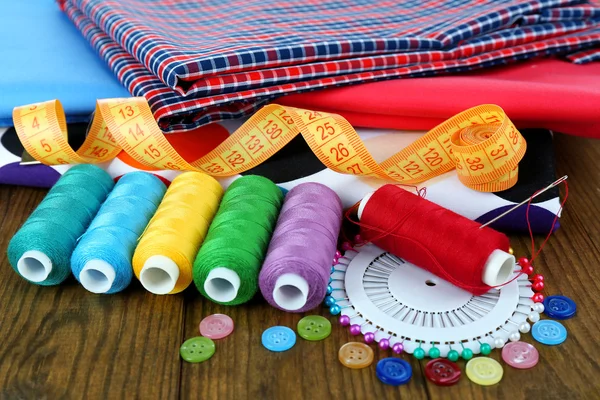 Sewing accessories on wooden table — Stock Photo, Image