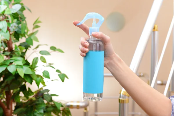Sprayed air freshener in hand close-up — Stock Photo, Image