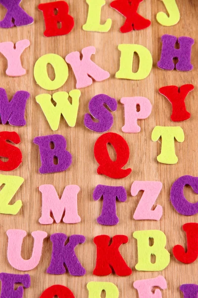 English alphabet on wooden background — Stock Photo, Image