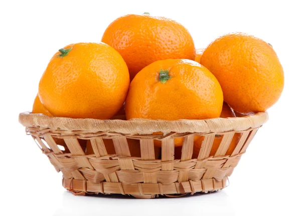 Ripe sweet tangerines in wicker basket, isolated on white — Stock Photo, Image