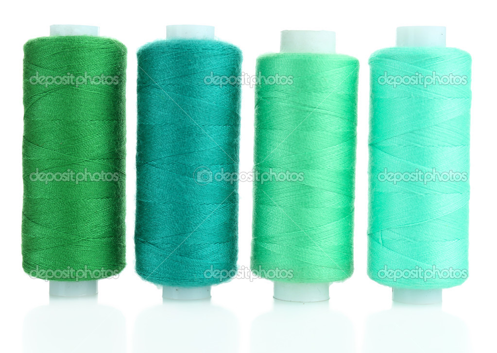 Colored spools of threads isolated on white