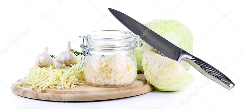 Marinated cabbage (sauerkraut) in glass jar, isolated on white