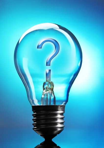 Question mark in lightbulb on blue background — Stock Photo, Image