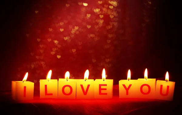 蜡烛与打印标志我爱你，对模糊背景灯 — 图库照片