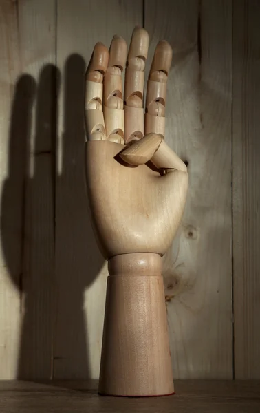 Wooden hand on wooden background — Stock Photo, Image