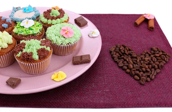 Tasty cupcakes with butter cream, on plate, on color napkin. isolated on white — Stock Photo, Image