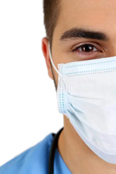 Young male doctor in medical mask, close-up, isolated on white — Stock Photo, Image