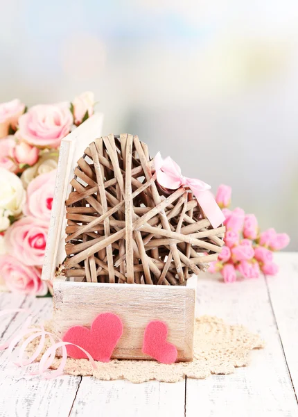 Romantic still life with heart in wooden casket — Stock Photo, Image