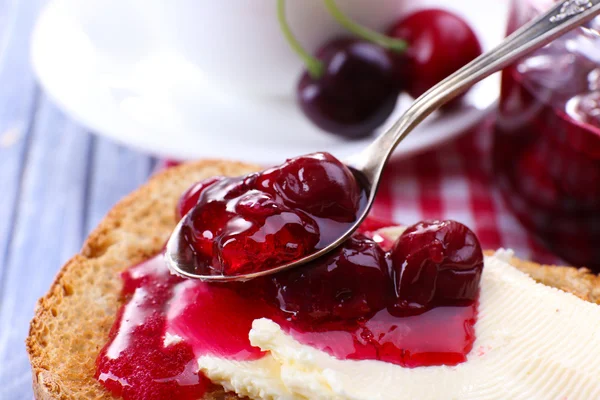 Delicious toast with jam on table close-up — Stock Photo, Image