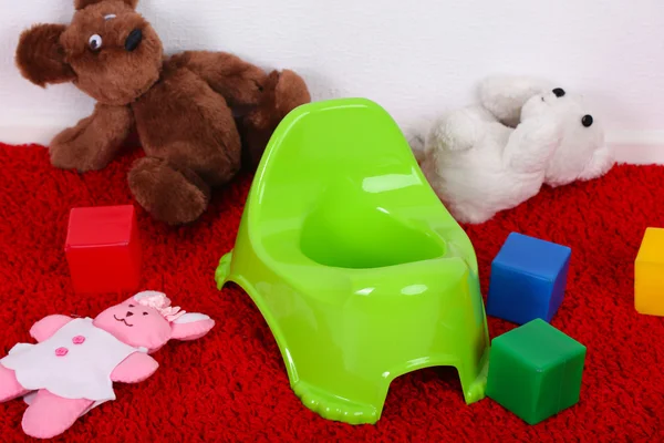 Green potty on home interior background — Stock Photo, Image