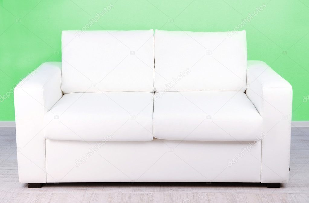 White sofa in room on green background