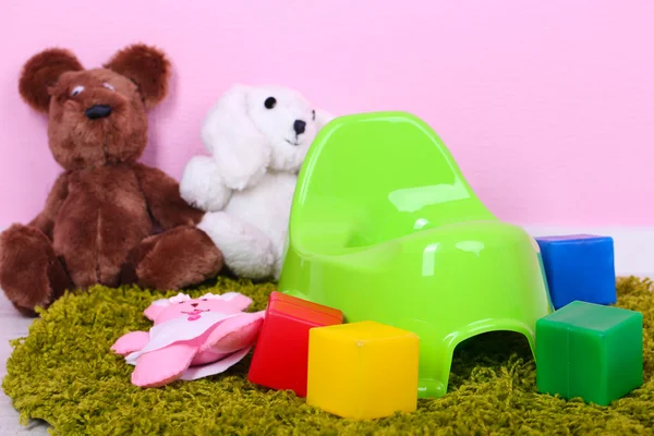 Green potty on home interior background — Stock Photo, Image