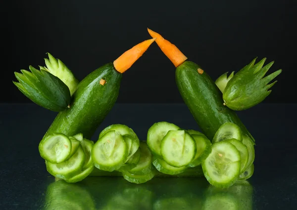 Carving vegetable pattern of hummingbirds on grey background — Stock Photo, Image