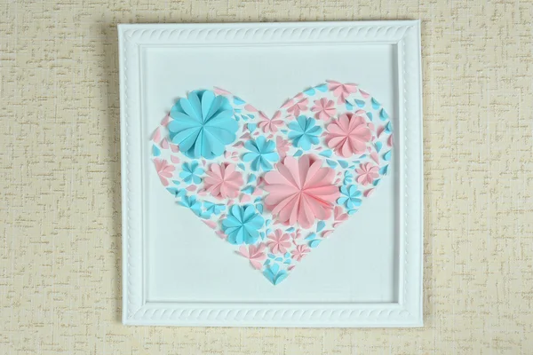 Beautiful handmade picture with heart from paper flowers on wall — Stock Photo, Image