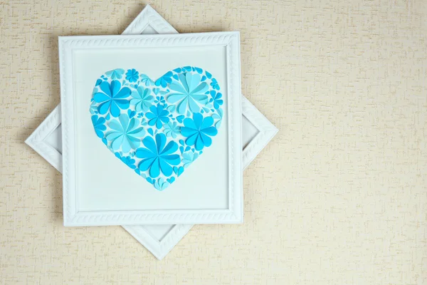 Beautiful handmade picture with heart from paper flowers on wall — Stock Photo, Image