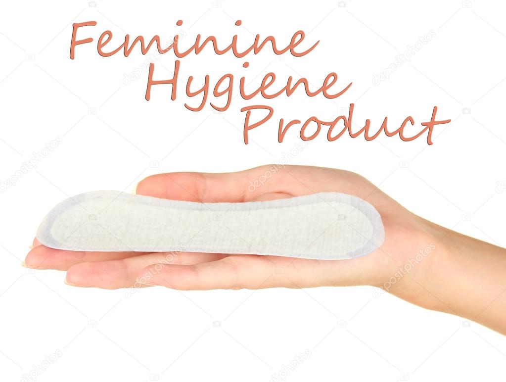 woman's hand holding a daily sanitary pad on white background close-up