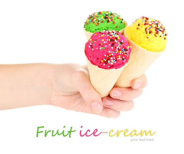 Three scoops of lemon, strawberry and kiwi ice cream in the waffle cones decorated with sprinkles — Stockfoto