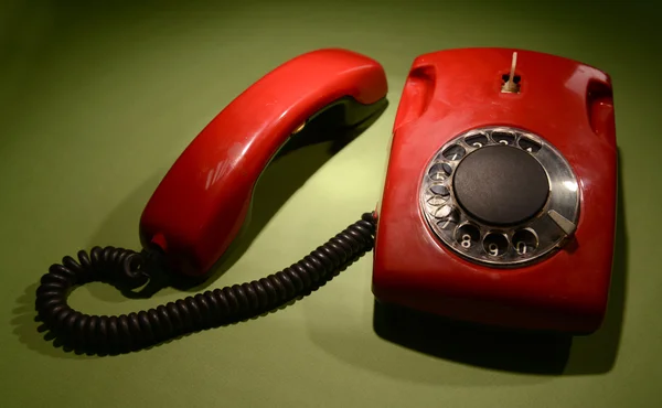 Red retro telephone on dark color background — Stock Photo, Image