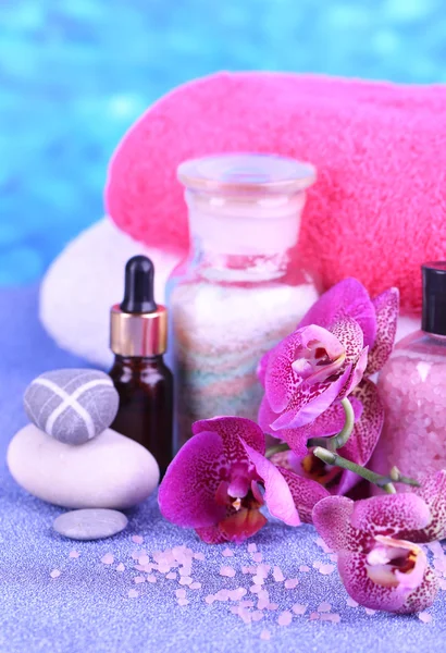 Beautiful spa setting with orchid on blue background — Stock Photo, Image