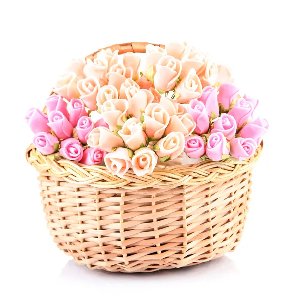 Bouquet of beautiful artificial flowers in wicker basket, isolated on white — Stock Photo, Image