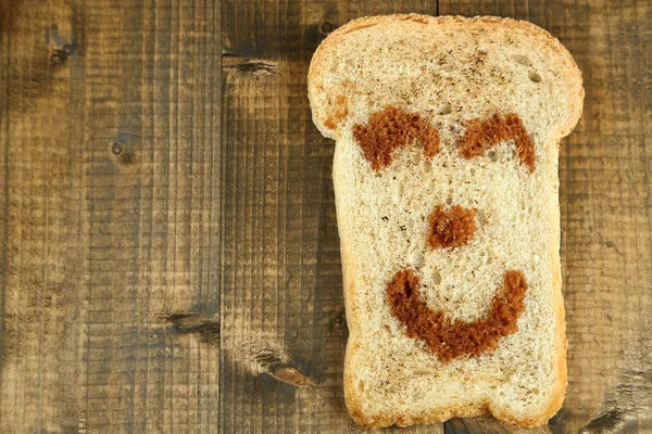 Funny toast, on wooden background — Stock Photo, Image