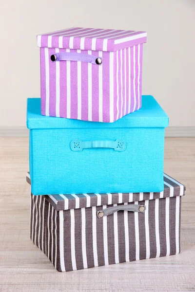 Textile boxes on floor in room — Stock Photo, Image