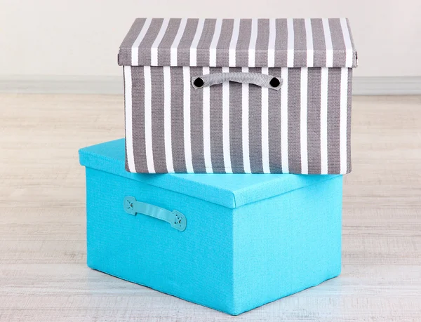 Textile boxes on floor in room — Stock Photo, Image